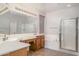 Double sink bathroom with soaking tub and walk-in shower at 7855 E Kramer St, Mesa, AZ 85207