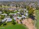 Aerial view showcasing home's desirable location near a lake and golf course at 4906 E Lake Point Cir, Phoenix, AZ 85044