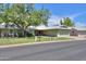 Charming single-story home with a well-maintained lawn at 4906 E Lake Point Cir, Phoenix, AZ 85044