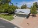 Single-story home with a two-car garage and lake view at 4906 E Lake Point Cir, Phoenix, AZ 85044