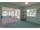 Sunroom with access to a patio and lake view at 4906 E Lake Point Cir, Phoenix, AZ 85044