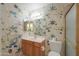 Bathroom with floral wallpaper and vanity at 4906 E Lake Point Cir, Phoenix, AZ 85044