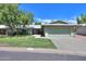 House with green exterior and attached garage at 4906 E Lake Point Cir, Phoenix, AZ 85044