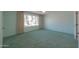 Bright bedroom with window, carpet, and mirrored closet doors at 4906 E Lake Point Cir, Phoenix, AZ 85044