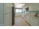 Galley kitchen with ample cabinet space and stainless steel appliances at 4906 E Lake Point Cir, Phoenix, AZ 85044