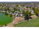 Aerial view showing home's location in community by lake and golf course at 4906 E Lake Point Cir, Phoenix, AZ 85044