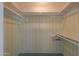 Large closet with shelves and hanging rods at 4906 E Lake Point Cir, Phoenix, AZ 85044