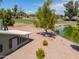 Aerial view of home and backyard near lake and golf course at 4906 E Lake Point Cir, Phoenix, AZ 85044
