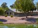 Backyard of home with screened patio overlooking a lake at 4906 E Lake Point Cir, Phoenix, AZ 85044