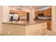 Modern kitchen with stainless steel appliances and light wood cabinets at 16428 W Labyrinth Ln, Surprise, AZ 85374