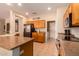 Spacious kitchen island with double sink and dishwasher, open to dining area at 16428 W Labyrinth Ln, Surprise, AZ 85374