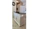 White kitchen island with black granite countertop and storage at 2233 E Behrend Dr # 41, Phoenix, AZ 85024