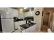 Spacious kitchen with white cabinets, black counters, and island at 2233 E Behrend Dr # 41, Phoenix, AZ 85024
