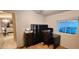 Home office with built-in shelving and view into living area at 2233 E Behrend Dr # 41, Phoenix, AZ 85024