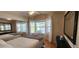 Bedroom with bay window, wood flooring, and ample natural light at 2233 E Behrend Dr # 41, Phoenix, AZ 85024