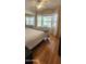 Bright bedroom with bay window, ceiling fan, and wood flooring at 2233 E Behrend Dr # 41, Phoenix, AZ 85024