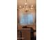 Elegant dining area with a crystal chandelier and window blinds at 2233 E Behrend Dr # 41, Phoenix, AZ 85024