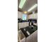 Bright kitchen features white cabinets, black countertops, and modern appliances at 2233 E Behrend Dr # 41, Phoenix, AZ 85024