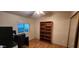 Bright bedroom with a bookcase and a window offering a water view at 2233 E Behrend Dr # 41, Phoenix, AZ 85024