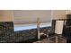 Close-up of kitchen sink, faucet, and black tile backsplash at 2233 E Behrend Dr # 41, Phoenix, AZ 85024