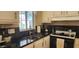 Modern kitchen sink with black countertops and stylish faucet at 2233 E Behrend Dr # 41, Phoenix, AZ 85024