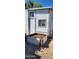 Mobile home exterior with a raised garden bed at 2233 E Behrend Dr # 41, Phoenix, AZ 85024