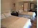 Primary bedroom with mirrored closet doors and a queen-sized bed at 2233 E Behrend Dr # 41, Phoenix, AZ 85024