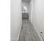 Long hallway with gray tile flooring and access to rooms at 2209 E Sheridan St, Phoenix, AZ 85006