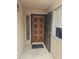 Inviting front entrance with an ornate wood door and security screen at 3345 E University Dr # 25, Mesa, AZ 85213