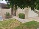 Front entrance of a condo with gate, landscaping, and a pergola at 3345 E University Dr # 25, Mesa, AZ 85213