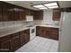 Efficient kitchen featuring wood cabinets and a tiled floor at 3345 E University Dr # 25, Mesa, AZ 85213