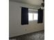 Bedroom with carpet, double window, and dark blue curtains at 3345 E University Dr # 25, Mesa, AZ 85213