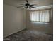 Bright bedroom with carpet flooring, ceiling fan, and window coverings at 3345 E University Dr # 25, Mesa, AZ 85213