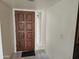 Bright entryway with wood door and tile flooring at 3345 E University Dr # 25, Mesa, AZ 85213