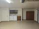 Spacious garage with washer, dryer, and ample storage cabinets at 3345 E University Dr # 25, Mesa, AZ 85213