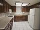 Functional kitchen with wood cabinets and modern appliances at 3345 E University Dr # 25, Mesa, AZ 85213