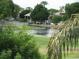 Peaceful view of a lake, golf course, and neighboring homes from a balcony at 21956 N 59Th Ln, Glendale, AZ 85310