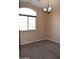 Bright bedroom featuring a large window and ceiling fan at 21956 N 59Th Ln, Glendale, AZ 85310