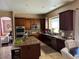 Spacious kitchen featuring granite countertops and dark wood cabinets at 21956 N 59Th Ln, Glendale, AZ 85310