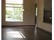 Bright dining room with hardwood floors and a view of the pool at 21956 N 59Th Ln, Glendale, AZ 85310