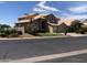 Two-story house with a three-car garage and desert landscaping at 21956 N 59Th Ln, Glendale, AZ 85310