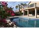 Inviting pool with a large patio and bougainvillea plants at 21956 N 59Th Ln, Glendale, AZ 85310