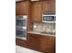 Stainless steel appliances and granite countertops in this kitchen at 21956 N 59Th Ln, Glendale, AZ 85310