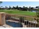 Scenic view of pool, golf course, and lake from backyard at 21956 N 59Th Ln, Glendale, AZ 85310