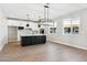 Modern kitchen with white cabinets, large island, and stainless steel appliances at 5816 E Montara Pl, Mesa, AZ 85215