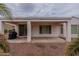 Covered patio with sliding glass doors at 13441 W El Sueno Ct, Sun City West, AZ 85375