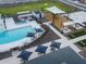 Resort-style pool with lounge chairs and umbrellas at 3073 E Hayden Rose Ave, San Tan Valley, AZ 85143