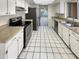 Bright kitchen with stainless steel appliances and white cabinets at 1930 S Westwood -- # 23, Mesa, AZ 85210