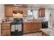 Spacious kitchen with wood cabinets and granite countertops at 6835 W Taylor St # 208, Phoenix, AZ 85043