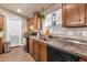 Spacious kitchen with wood cabinets and granite countertops at 6835 W Taylor St # 208, Phoenix, AZ 85043
